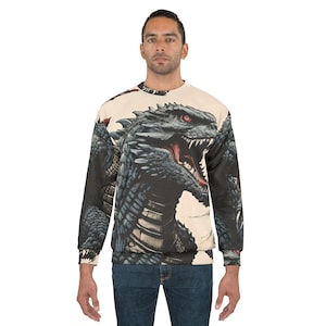 May include: Crew neck sweatshirt with a detailed illustration of a black dragon with red eyes and an open mouth. The dragon design is printed on a beige background. The long-sleeved sweatshirt is made of a soft material.