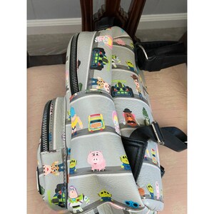 Loungefly Disney Pixar Toy Story Woody & Buzz Clouds Mini Backpack Andy Room image 10
