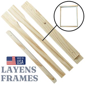 May include: Four wooden frames for building a beehive. The frames are made of unfinished wood and are ready to be assembled. The frames are made in the USA. The text "Layens Frames" is printed on the bottom of the image.