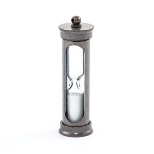 May include: A small, antique-style hourglass with a silver finish. The hourglass is filled with white sand and has a clear glass bulb.