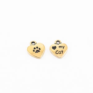 Dije de corazón de gato, oro antiguo, dos caras, 10 x 10 mm, grabado: "Heart my Cat" y huella de pata, 2 unidades