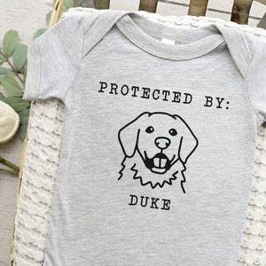 Protected By Dog Onesie®, Custom Dog Breed Onesie®, Personalized Dog Name Baby Onesie®, Dog Sibling Outfit, Baby Shower Gift, Typewriter Heather Grey