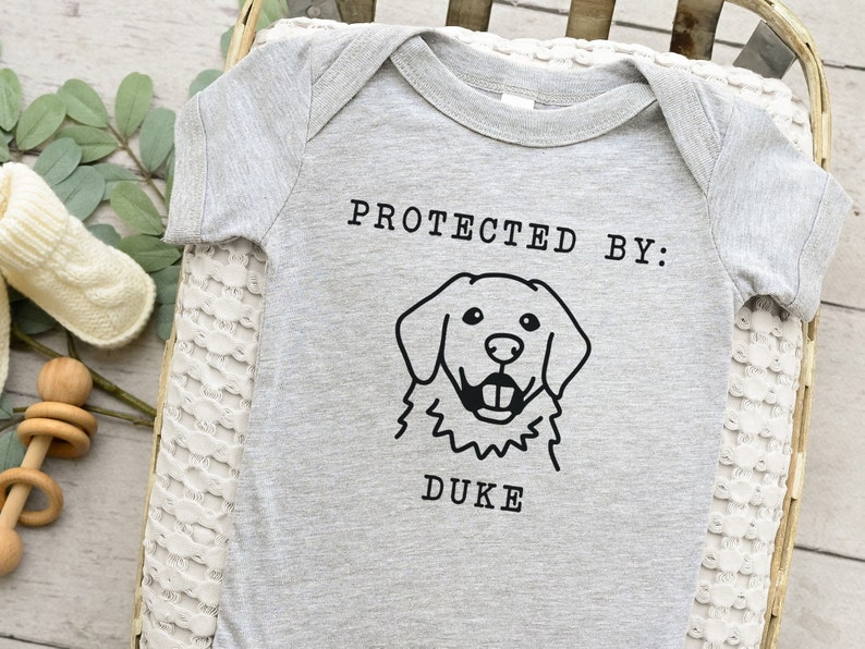 Protected By Dog Onesie®, Custom Dog Breed Onesie®, Personalized Dog Name Baby Onesie®, Dog Sibling Outfit, Baby Shower Gift, Typewriter Heather Grey
