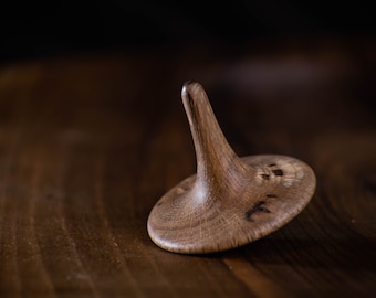 Wooden spinning top with unique design. Perfect toy. Toy gift