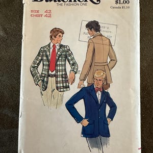 May include: Vintage Butterick sewing pattern envelope featuring illustrations of men's blazers and coats. The envelope displays the text "Butterick THE FASHION ONE" and "SIZE 42 CHEST 42". The pattern number is 3020.
