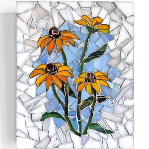 May include: A mosaic artwork featuring four yellow and orange coneflowers with dark brown centers and green stems against a light blue and white background. The mosaic is made of small, irregular pieces, creating a textured effect.