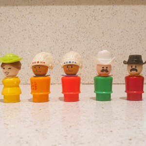 May include: A set of eight vintage plastic figurines, each with a different head and hat. The figurines are in various colors, including black, yellow, orange, red, green, and blue.