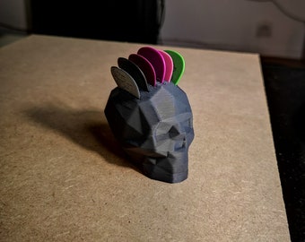 Porta púas de guitarra con forma de calavera