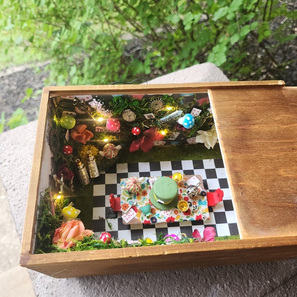 Handmade art piece. Hidden box Alice in wonderland tea party. Lights up.