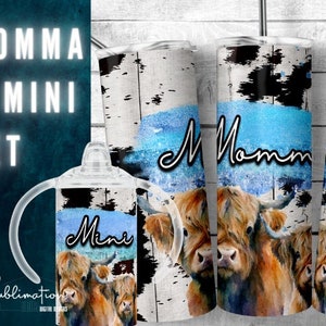 May include: A set of three stainless steel tumblers with a white woodgrain background, blue watercolor accents, and a Highland cow design. The tumblers are labeled "Momma" and "Mini".