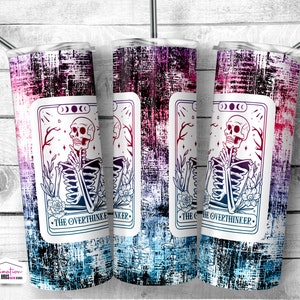 May include: Three stainless steel tumblers with a distressed, grunge-style background. Each tumbler features a tarot card design with a skeleton holding a skull and the text "The Overthinker".