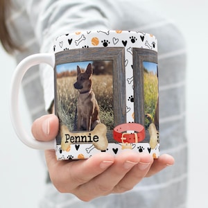 May include: White ceramic mug with a dog-themed design. The mug features two framed photos of dogs, a red dog collar, and the name "Pennie" printed on the mug.