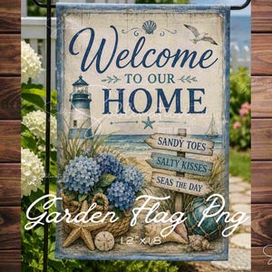 May include: A rectangular garden flag with a coastal theme. The flag features a lighthouse, seashells, and the words "Welcome to our Home." Additional text includes "Sandy Toes, Salty Kisses, Seas the Day." The flag measures 12" x 18".