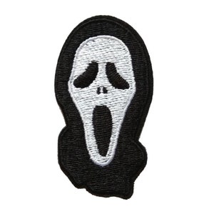 May include: A black and white embroidered patch featuring the iconic Scream mask design. The patch has a black border and a white face with black eye and mouth details. This patch is suitable for jackets, bags, or other fabric items.