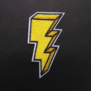 May include: Yellow embroidered lightning bolt patch with a white outline. The patch is on a black background.