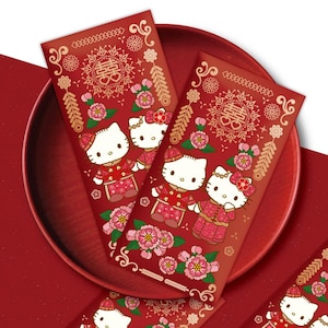 May include: Two red envelopes with gold accents featuring Hello Kitty and Dear Daniel dressed in traditional Chinese wedding attire. The envelopes are decorated with flowers, firecrackers, and the Chinese character for "double happiness".