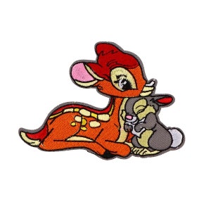 May include: Embroidered patch featuring a cartoon Bambi the deer lying down with Thumper the rabbit in its arms. Bambi is orange and brown with white spots. Thumper is gray with a pink nose.