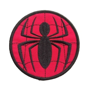 May include: A red and black embroidered iron-on patch featuring a spider web with a black spider in the center.