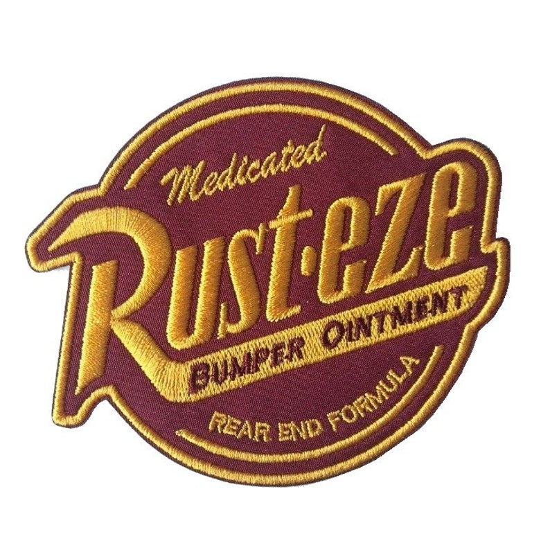 Écusson thermocollant brodé Rust-eze avec logo Les voitures du film Rust-eze Logo