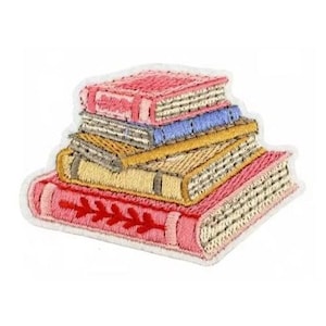 May include: Embroidered patch featuring a stack of books in shades of pink, yellow, and blue. The books have detailed stitching, with visible pages and decorative elements. The patch has a white border, suitable for application on fabric.