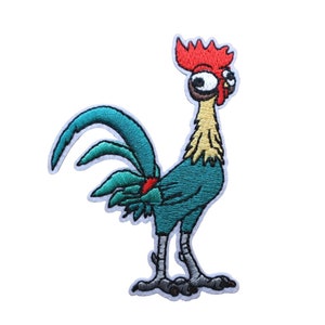 May include: Embroidered patch of a cartoon rooster with a red comb, large eyes, and a blue and green body. The rooster is standing with its tail feathers spread out.