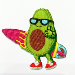 May include: Embroidered patch of a green avocado character wearing sunglasses and red trainers. The avocado is holding a colourful surfboard and giving a thumbs-up gesture. The patch has a brown seed and is on a white background.