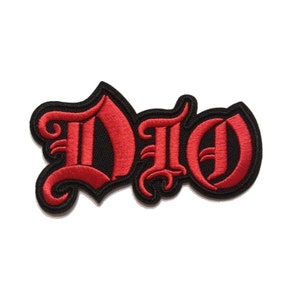 May include: Red embroidered iron-on patch with the word "DIO" in a gothic font.