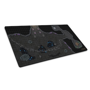 May include: A rectangular, black gaming mat featuring a detailed map of a dungeon or cave system. The map includes pathways, chambers, and various terrain elements in shades of gray, with accents of blue, purple, and brown. A grid pattern covers the entire surface.
