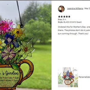 May include: Stained glass suncatcher featuring a bouquet of colorful flowers in a decorative vase. The vase reads "Nana's Garden" with names below. Includes a black chain for hanging. Measures 6 inches.