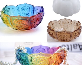 May include: A set of three rainbow colored glass bowls with a rose design. The bowls are in different shades of red, orange, yellow, green, blue, and purple. The bowls are perfect for serving snacks, desserts, or as decorative pieces.