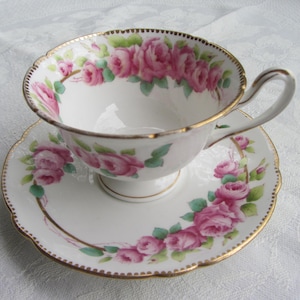 Antique Shelley hand painted tea cup and saucer with pink cabbage roses, English bone china with gilt detail. c1910-1925   Ref V