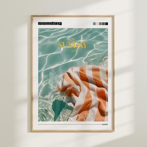 May include: A poster with a graphic design of a striped towel floating in a turquoise pool. The text "THE SUNDAY CLUB" is in yellow letters.