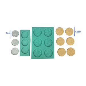 May include: A teal silicone mold with six circular cavities for making cookies, alongside three clear, round, glitter-filled resin pieces (4 cm diameter) and six beige cookie-shaped items (4.6 cm diameter).