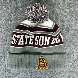May include: A knit beanie in gray, white, and maroon, featuring the text "STATE SUN DEVILS" in white. The beanie has a maroon and white pom-pom on top and a gold and maroon logo on the front.