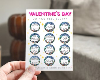 May include: Valentine's Day game card with a glittery background and 12 circles containing different activities. The text on the card reads "Valentine's Day Do You Feel Lucky?" and "With something hard, get 3 of a kind to win."