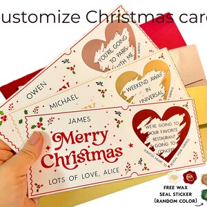 May include: A customizable Christmas card with a red heart and the text "Merry Christmas" and "Lots of Love, Alice". The card has a scratch-off feature to reveal a surprise message. The card is surrounded by envelopes and wax seals.