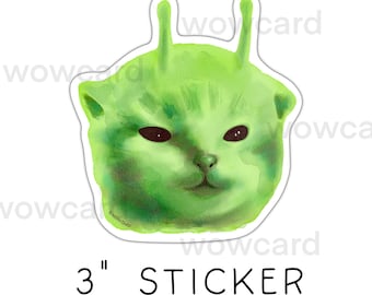 May include: A 3-inch sticker featuring a green alien cat with black eyes and antennae. The sticker has a white border and the word "STICKER" is printed in black below the image.