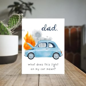 May include: A greeting card with a watercolor illustration of a light blue vintage car with its hood up and flames coming out. The text reads "dad, what does this light on my car mean?"