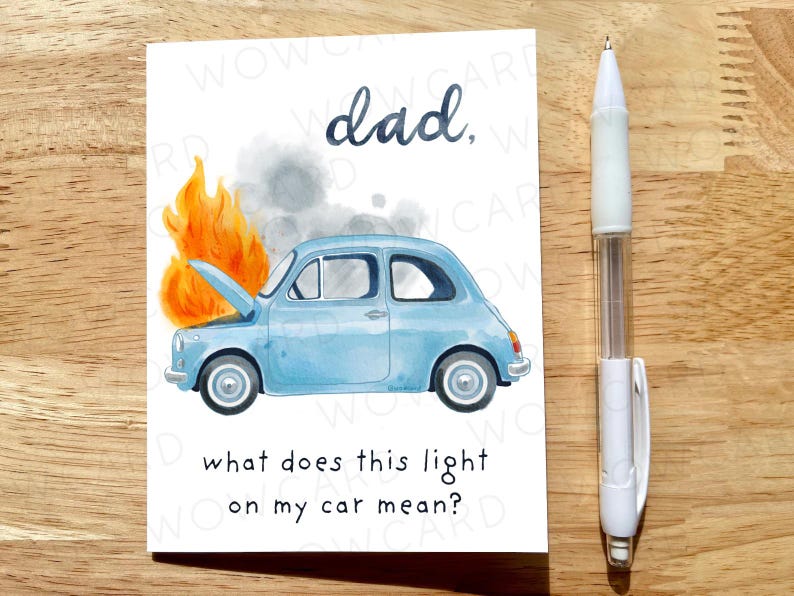 May include: A greeting card with a watercolor illustration of a light blue car on fire, with the text "dad," and "what does this light on my car mean?" A white pen is to the right of the card.