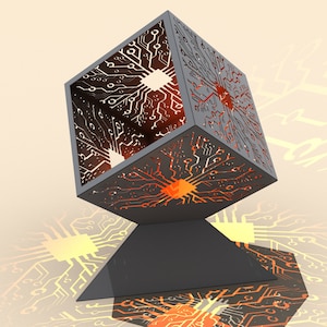 May include: A black metal cube with a circuit board design, lit from within with orange and yellow lights. The cube is sitting on a black triangular base.