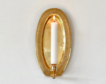 Antique Scandinavian handforged wall candle sconce with decoration made in solid brass.