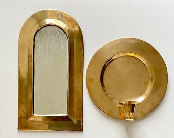 A set of Vintage Scandinavian wall candle sconce and mirror in solid brass.