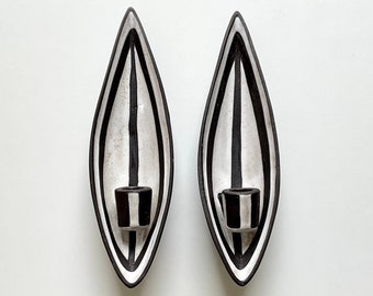 MARIANNE STARCK - A pair of Danish Mid-Century "Tribal" wall candle sconces in black and white, designed for Michael Andersen, 1960s.
