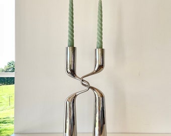 MIKAELA DÖRFEL-A pair of Vintage candlesticks “Twisted” in chrome. Made in Denmark by MENU ,1990s.