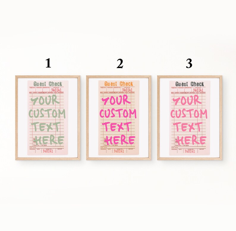 May include: Three framed prints of guest checks in light wood frames, numbered 1, 2, and 3. Each print features a pink background with grid lines and the text 'Guest Check' at the top, with 'YOUR CUSTOM TEXT HERE' in green, orange, or black.