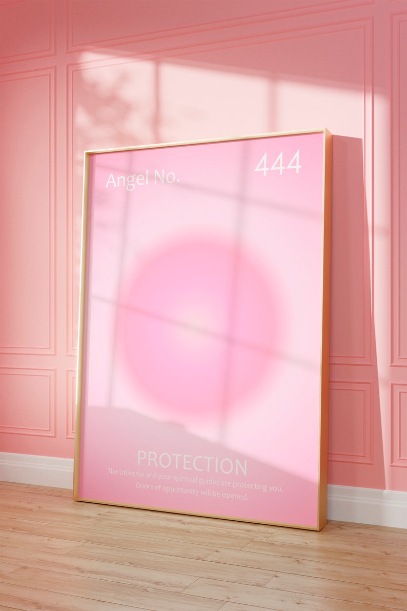 May include: A gold framed poster with a pink background and the text "Angel No. 444 PROTECTION The Universe and your spiritual guides are protecting you. Doors of opportunity will be opened."
