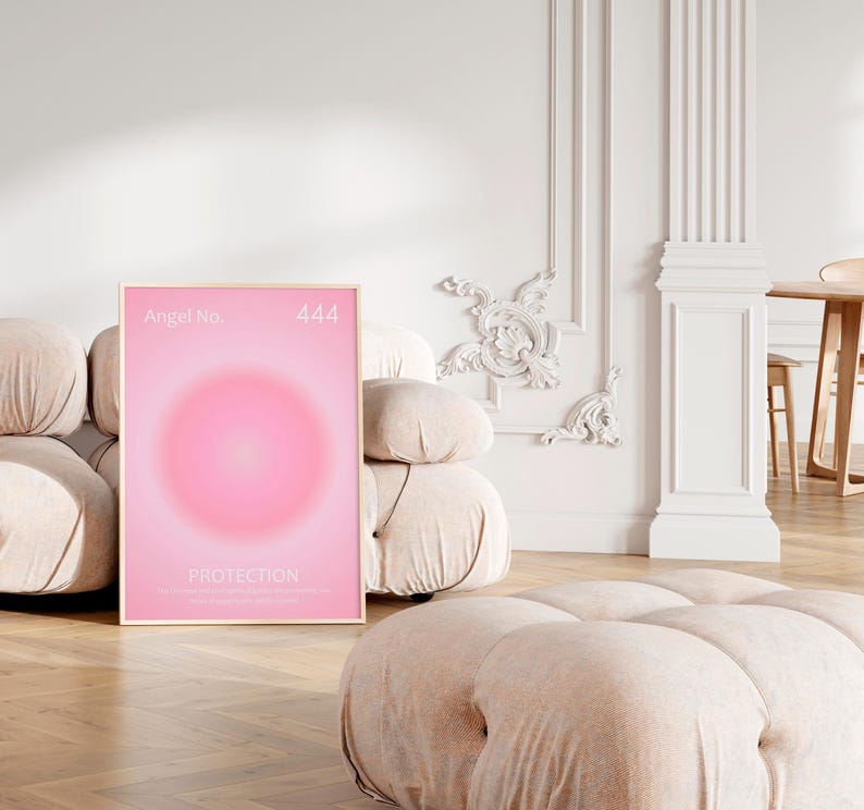 May include: A framed poster with a pink gradient background and a circle in the center. The poster has the text "Angel No. 444" at the top and "PROTECTION" in the center.
