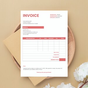 May include: A pink and white invoice template with the words "Invoice" and "Grand Total" in bold. The invoice includes fields for items, description, quantity, price, discount, tax, and total. The invoice also includes fields for sub-total, other fees, and tax amount. The invoice has a note that payment must be made on or before July 10, 2022.