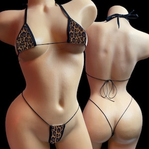 May include: A black and brown leopard print bikini with thin black straps. The bikini top is a triangle style and the bottom is a micro style.