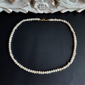 Necklace made of white cultured pearls 5-6x4-5 mm class AA pure with brilliant luster